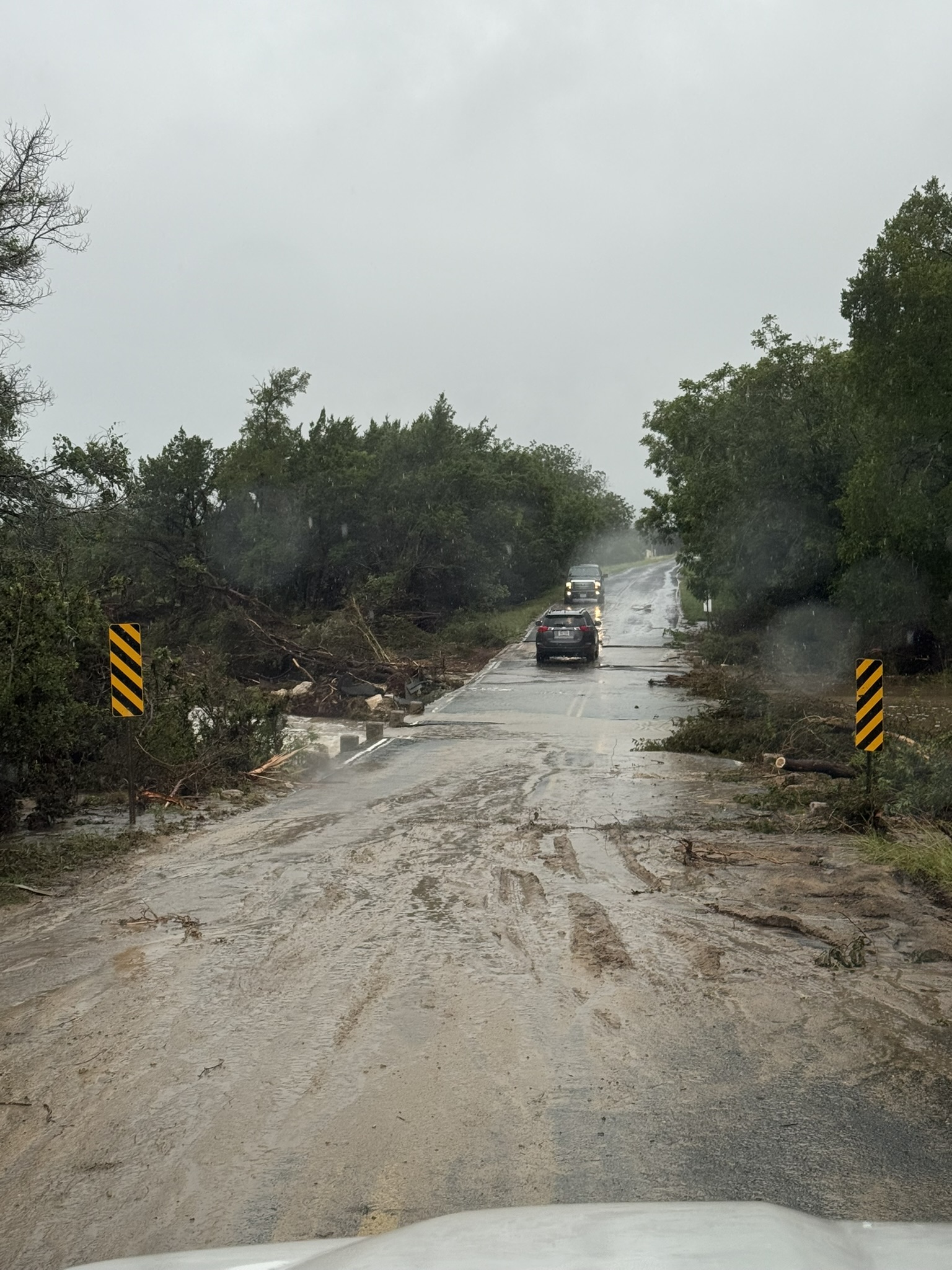 Sandy Creek road flooded with debris after the July 2025 storm
