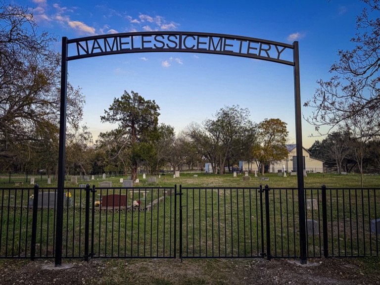 The iron gate arch of Nameless Cemetery
