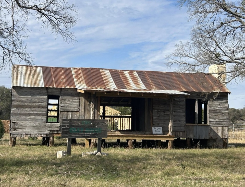The Gray homestead up close, showing the dog-run center and original cedar construction